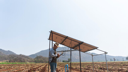 Fototapeta na wymiar agriculture installing solar panel system outdoors. Concept of alternative and renewable energy. solar cell system, smart farming concept, Water system technology in solar energy agriculture.