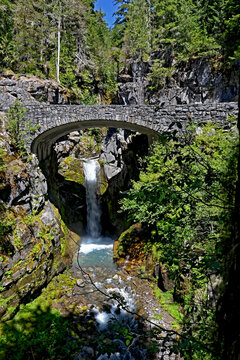 Rustic stone bridge and cascading mountain stream Mt Rainier National Park on a beautiful summer day_20230630_DSC_8102