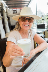 Tourist with pisco sour drink