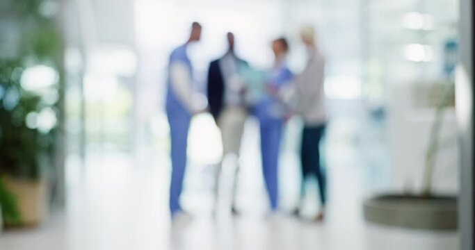 Pharmaceutical representatives, meeting or nurse in hospital blur for medicine update or schedule planning. Doctors, wellness or healthcare medical officers speaking of research report news together