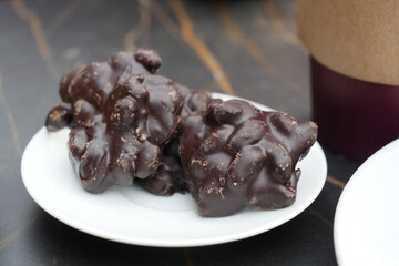 pistachios nut dark chocolate on a plate