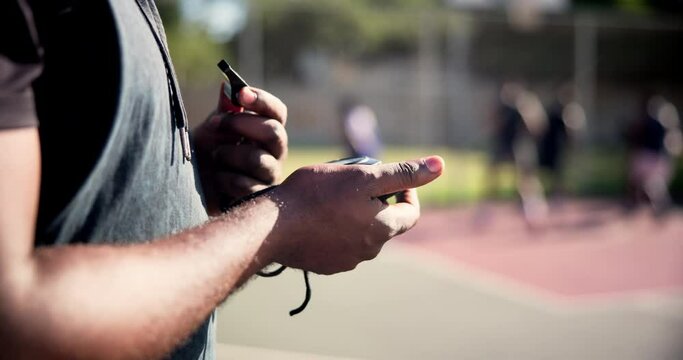 Whistle, sports and hands of coach on court for outdoor basketball match or team training. Stop watch, equipment and closeup of male trainer watching athletes practice for game on pitch or field.
