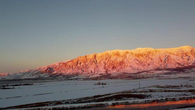4k Aerial Drone Snow-Capped Mountains Overlooking Willard Bay, Utah