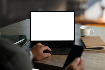 man working on his laptop with blank copy space screen mockup, template for your text