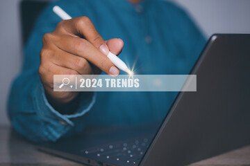 Businessman searching 2024 trend for business marketing planning target.