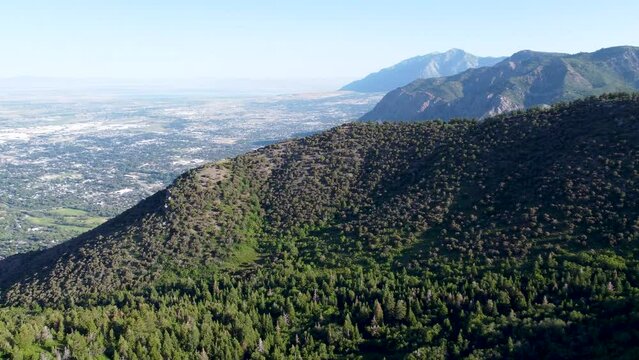 4k Aerial Taylor Canyon Ogden Utah Summer overlooking the city from the peak. 