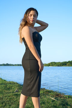 black dress, latina with blue sky and posing next to the lake 04