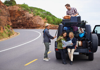 Friends, road trip and map or car on mountain with luggage on roof or adventure for vacation,...