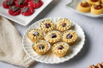 Popular cookies in Malaysia during celebration of Eid Mubarak (Hari Raya) on white background and selective focus.