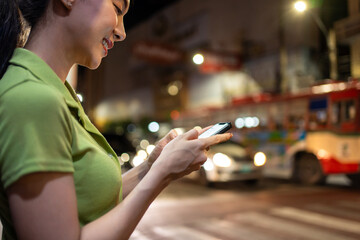 Asian attractive woman traveller chatting on phone while walk in city. 