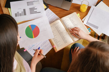 crop of unrecognizable university student study together