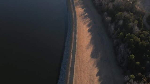 Aerial footage of a lake at golden hour.