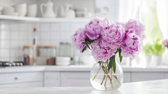 A bouquet of lilac beautiful peonies on the table of a  cozy kitchen