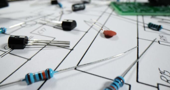 Different diodes put on paper electrical scheme in workshop