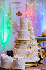 wedding cake with candles and flowers