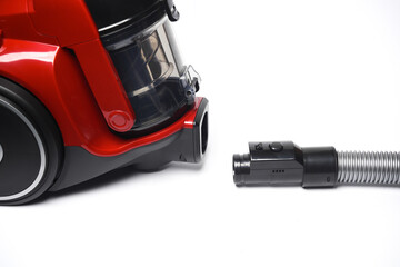 Fototapeta premium Red modern vacuum cleaner on a white background