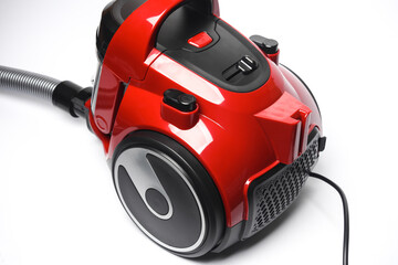 Red modern vacuum cleaner on a white background