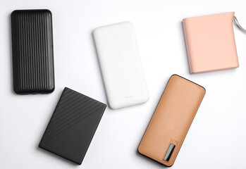Different power banks (external batteries) on white background