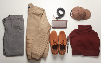 Men's clothes, shoes and accessories on a white background. Autumn seasonal clothing. Top view....