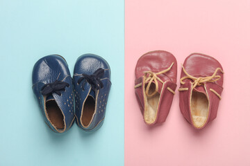 Children's leather shoes on a blue-pink background