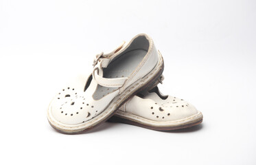 Children's retro used shoes on a white background