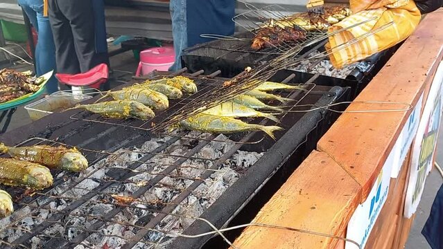 Grilled fish on charcoal grill.