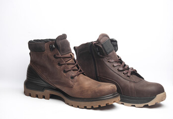 Different Brown leather boots on white background