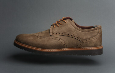 Leather Brogue shoe on a dark gray background