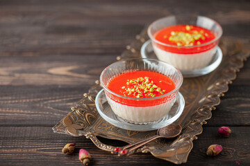 Malabi (muhallebi) milk rice pudding with pistachios. Arabic dessert