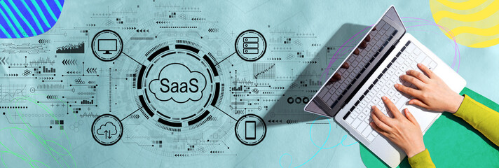 SaaS - software as a service concept with person using a laptop computer - 737769014
