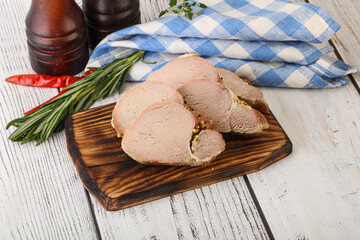 Baked pork tenderloin served rosemary