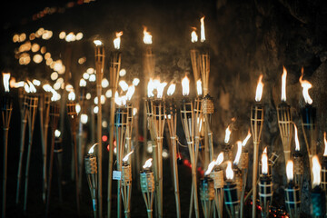 Many standing torches in night