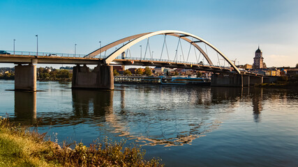 Fototapeta premium Summer view with reflections and a bridge at Vilshofen, Danube, Bavaria, Germany