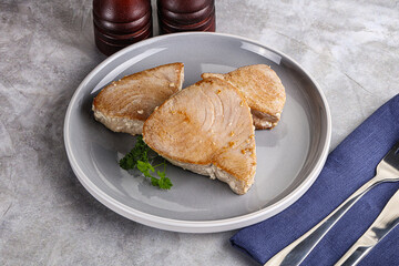 Roasted red tuna steak in the plate