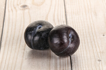 Two ripe sweet black plums