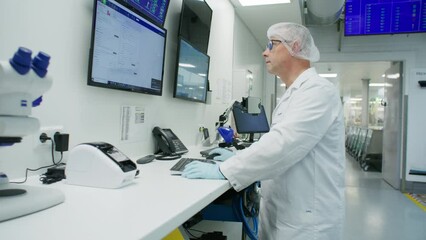 Plastic factory biochemist collecting data against defined parameters - Powered by Adobe