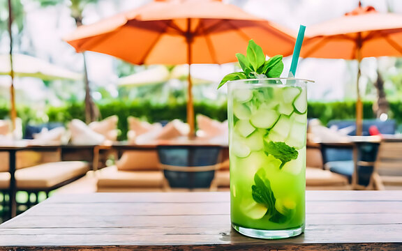 Refreshing mojito with fruit and umbrella at outdoor entertainment club