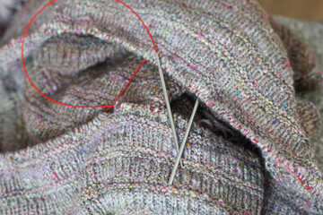 Beautiful handknit sweater, cardigan work in progress and on round knitting needles, made with pure...