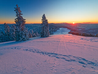 Sunset in the snow im Polish mountains beskidy