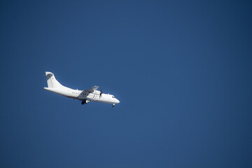 airplane preparing the landing bly sky background