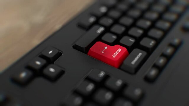Ready button on keyboard turned upside down. A finger presses Enter. Click ready. Realistic keyboard button. Red button ready. Get ready. Prepared. Set for action. Office keyboard with unique word to 