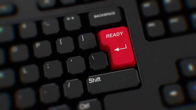Ready button on keyboard, close-up. A finger presses Enter. Click ready. Realistic keyboard button. Red button ready. Get ready. Prepared. Set for action. Office keyboard with unique word