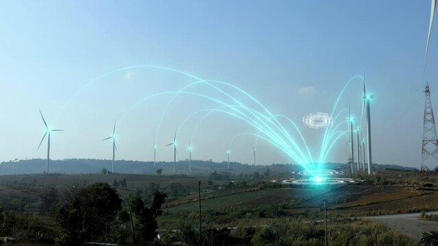 Wind turbine spinning and produce electricity to power plant with virtual digital effect of futuristic technology. Wind power turbines generating clean renewable energy for sustainable development.