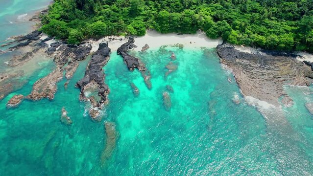 Aerial view above the cofffe beach, in ilheu das Rolas in  Sao Tome, Africa -  drone shot