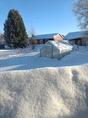 cold winter, deep snow in the garden, north of Sweden - 737832020