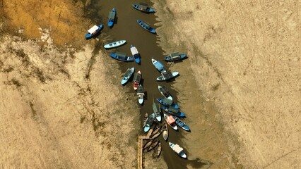 A dried lake and boats in Isparta, Turkey. A photo taken by a drone of a dried lake.