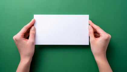 Female hands holding an empty white rectangular piece of paper with a green colorful background. Space for text, copy and other graphics. ai generated.