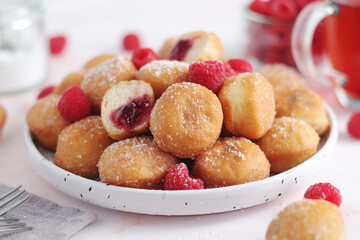 A plate wit traditional berliner cakes with jelly	