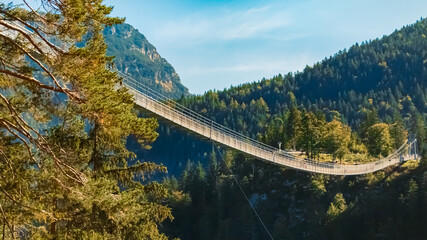 Alpine summer view at the famous Highline 179 suspension bridge and the Ehrenberg castle ruins near...