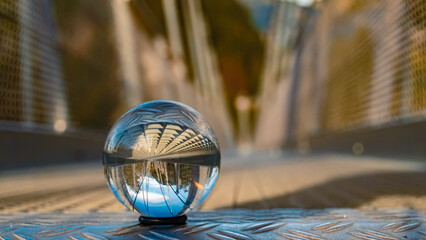 Crystal ball alpine landscape shot at the famous Highline 179 suspension bridge and the Ehrenberg...